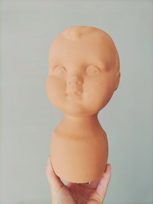 Cache-pot tête bébé