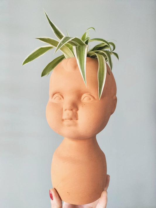 Cache-pot tête bébé