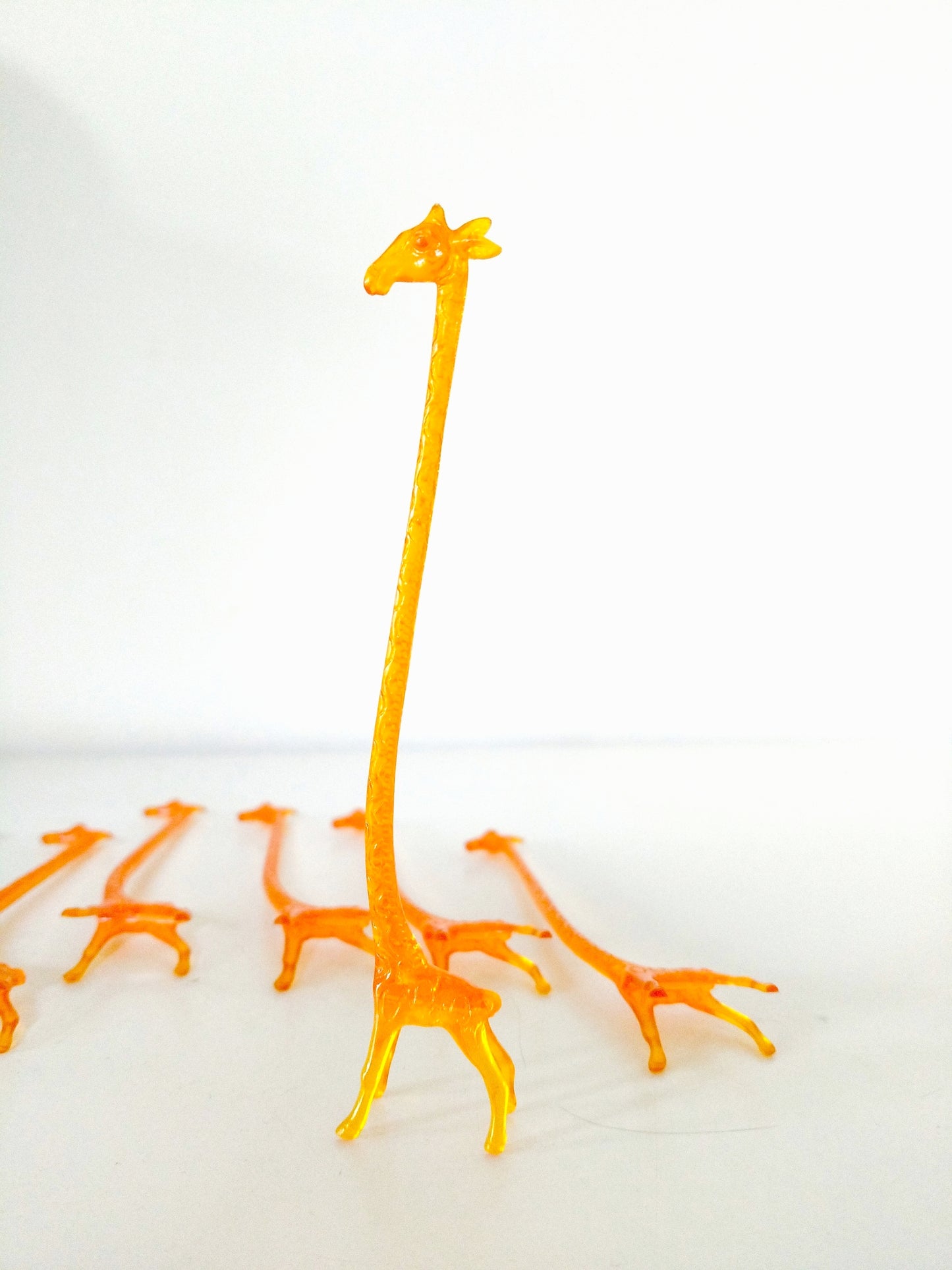 4 agitateurs à cocktail girafe en plastique (2 lots dispos)